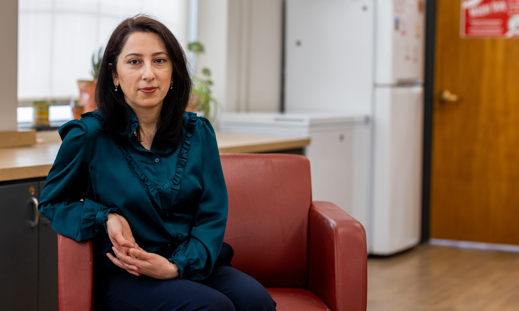 Zarrina Juraqulova sitting on a chair