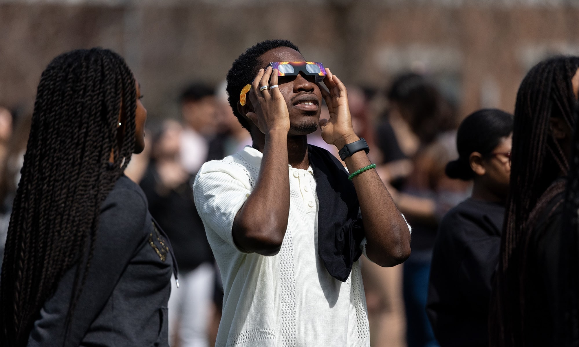 Student watching the solar eclipse