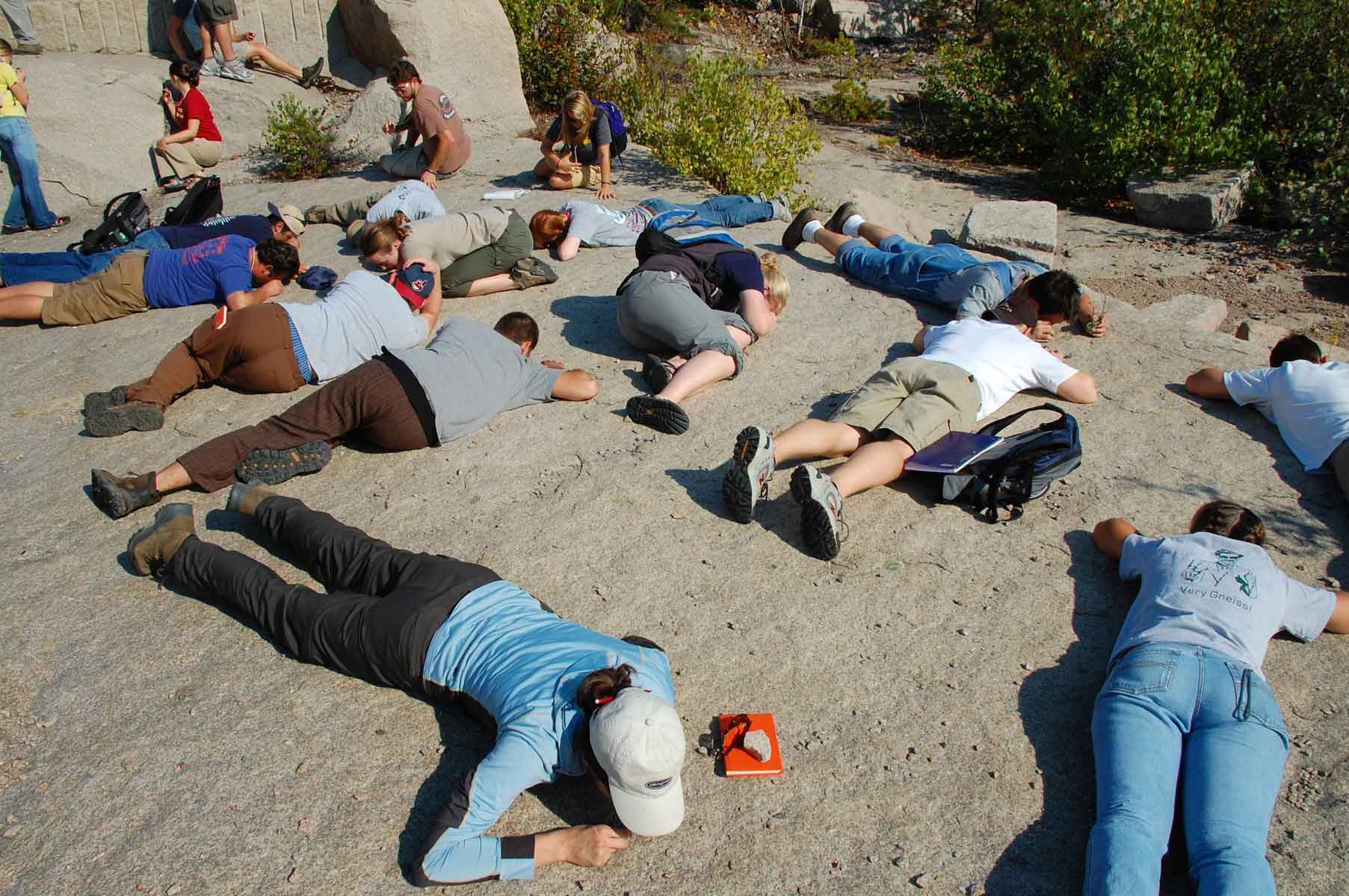 Students getting a close up look at granite in Hall Quarry.